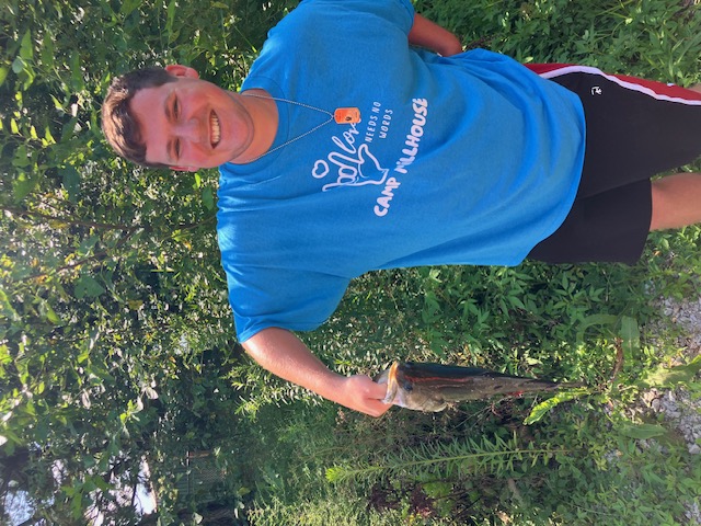 Fishing derby participant holding a catch